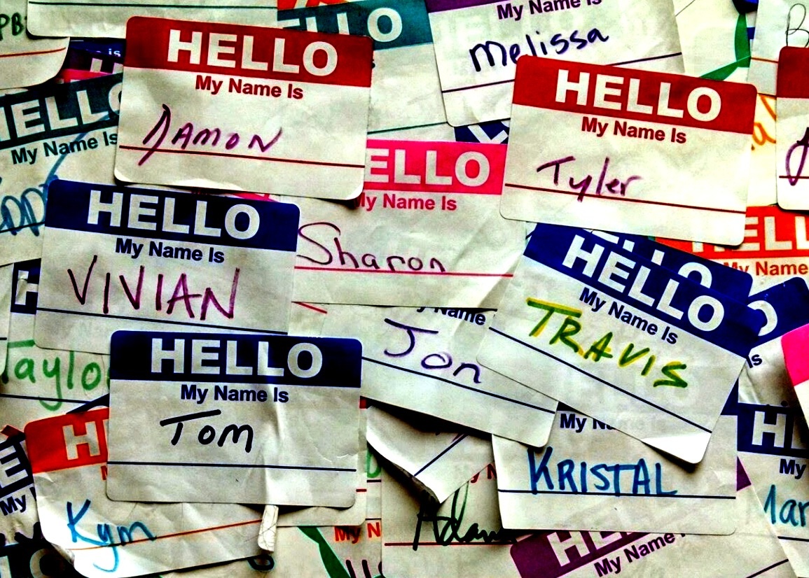 Group of overlapping name tags with "Hello My Name Is _____" written on each