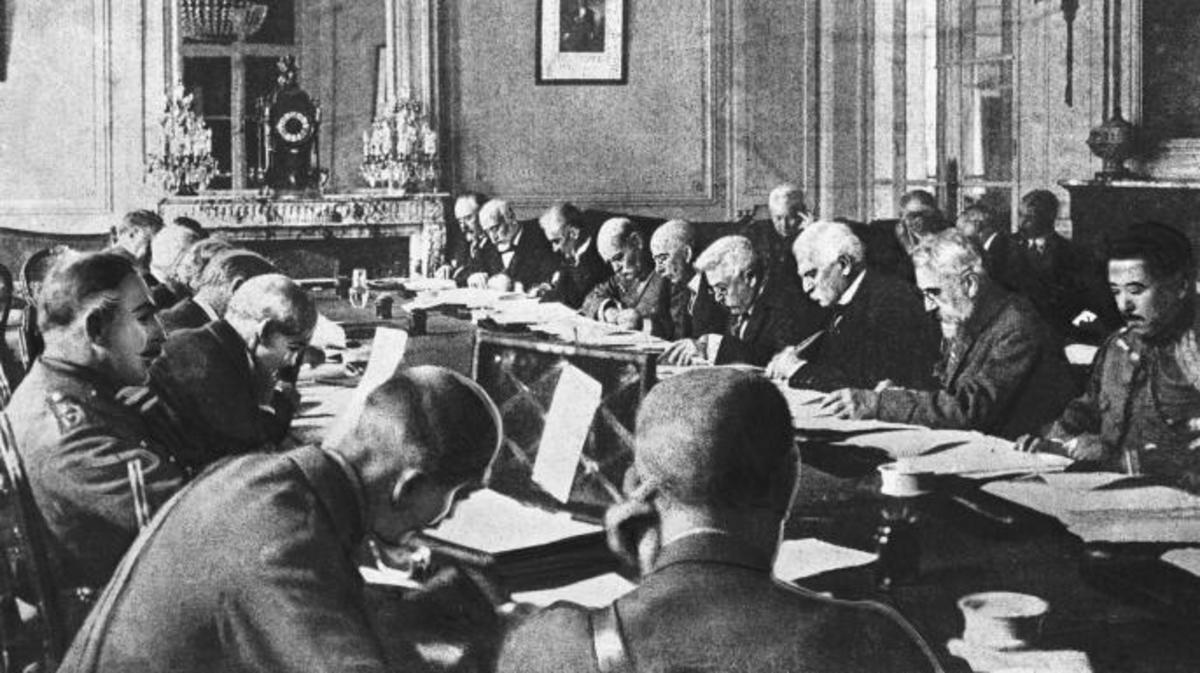 Officials at the signing of the Treaty of VersaillesDescription generated with very high confidence